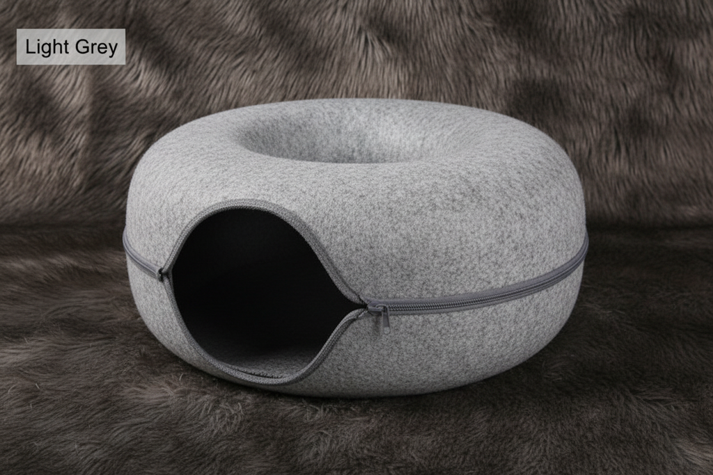 Light grey felt donut cat tunnel nest hero shot on faux fur