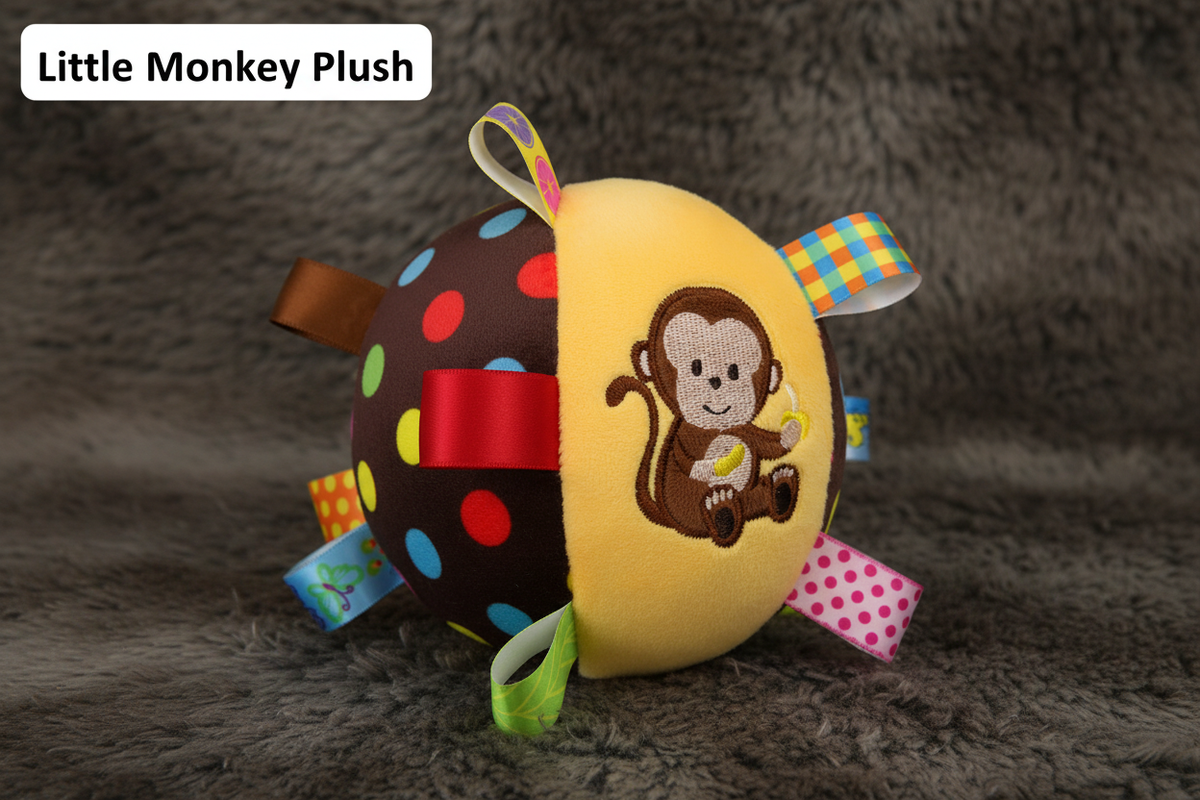 Little Monkey Plush brown polka dot ball hero shot on faux fur